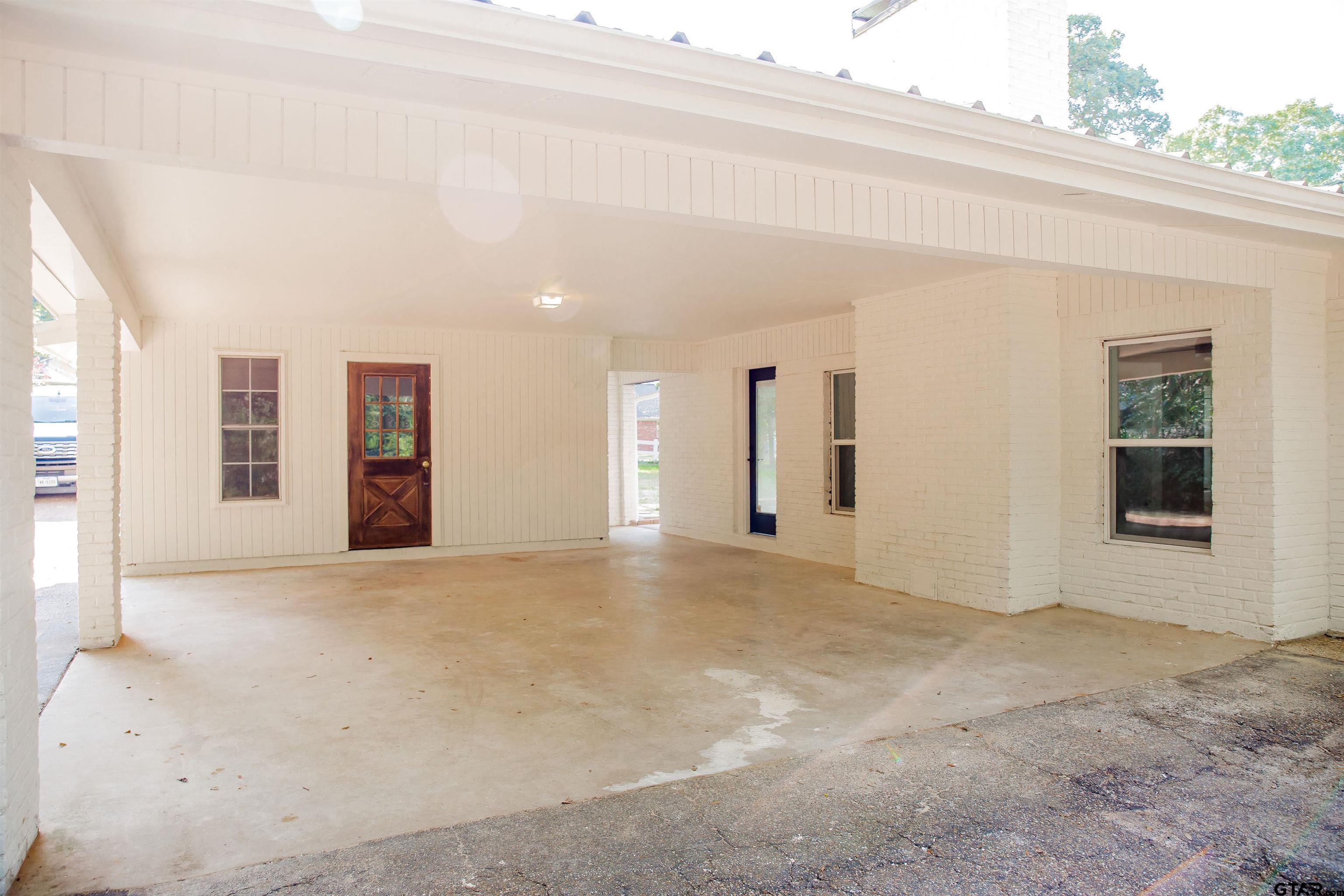 439 Lone Star Lane Hideaway, TX 75771 - Photo 6 of 36 a view of an empty room with a window