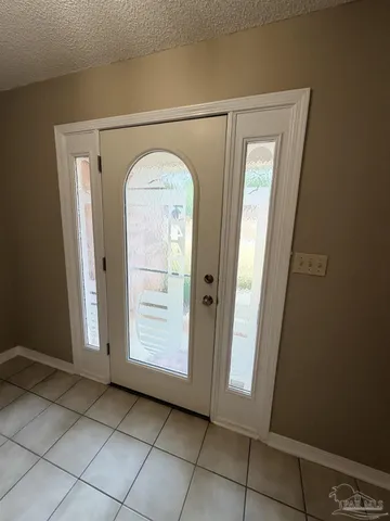 a bedroom with a bed and a mirror