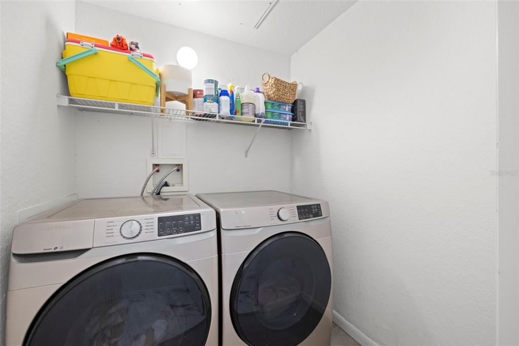 2410 West Azeele Street, Unit 214 Tampa, FL 33609 - Photo 18 of 24 a utility room with dryer and washer