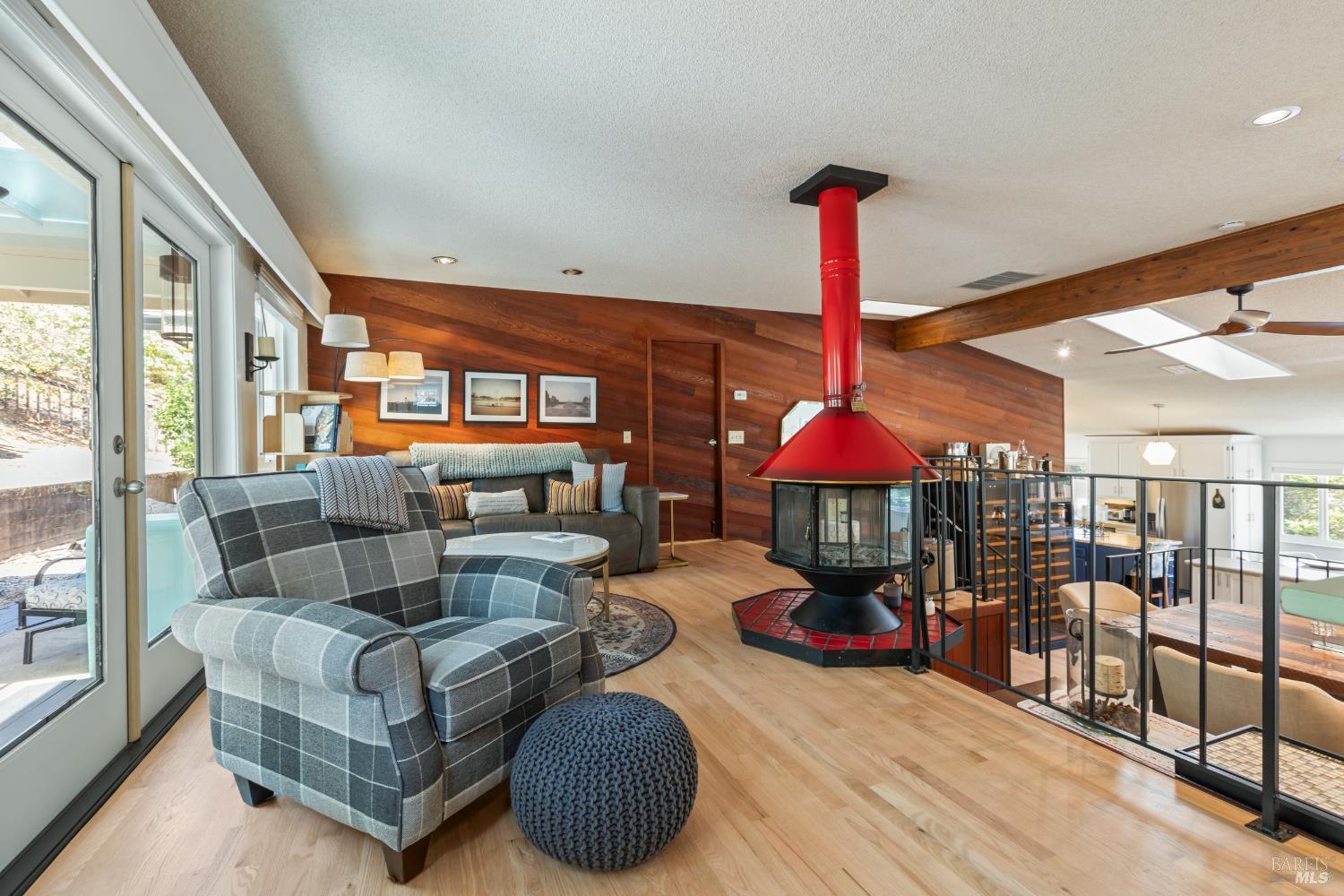 410 Oak Mesa Court Santa Rosa, CA 95409 - Photo 11 of 41 a living room with furniture a couch and a chandelier