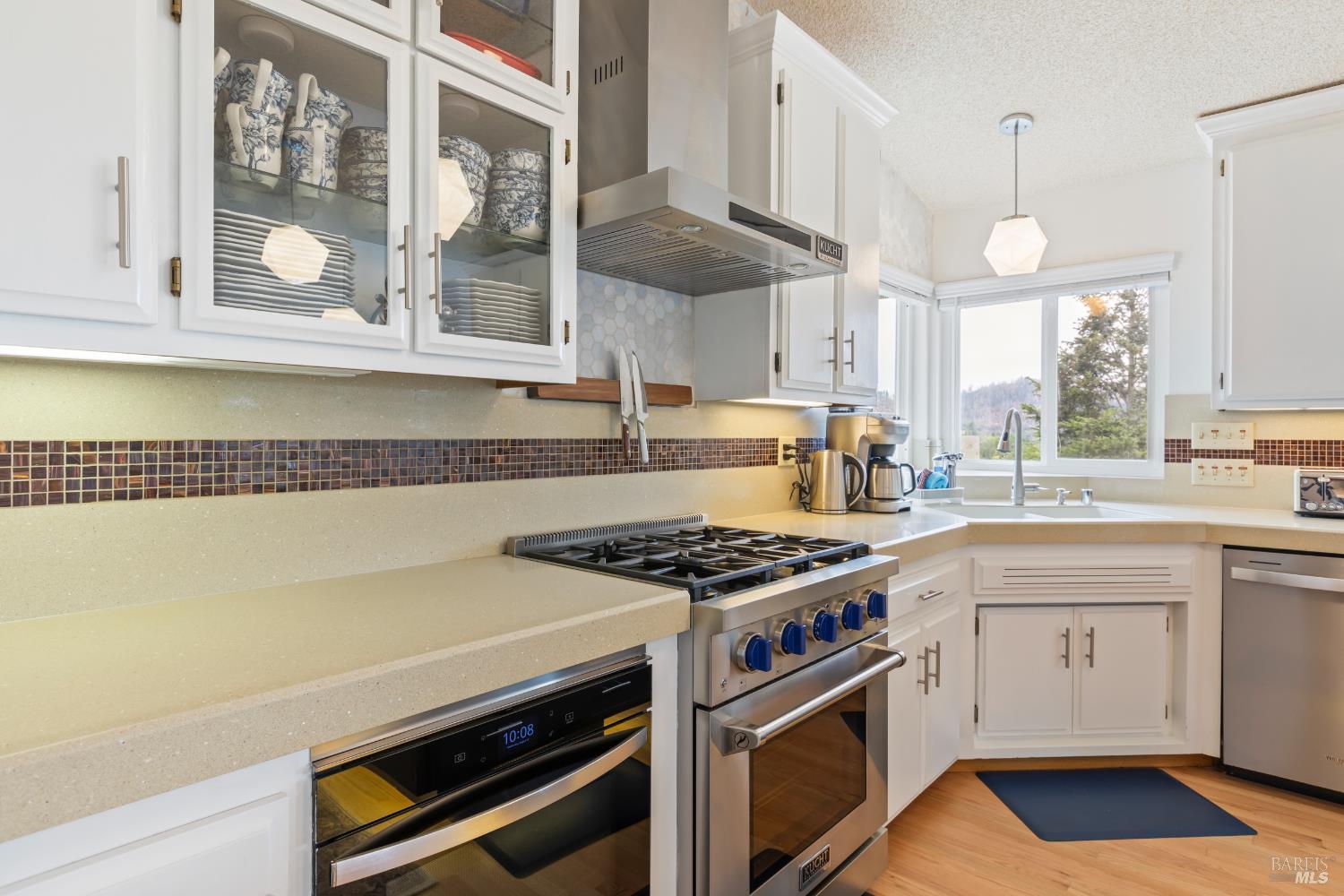 410 Oak Mesa Court Santa Rosa, CA 95409 - Photo 13 of 41 a kitchen with stainless steel appliances a stove a sink and a microwave