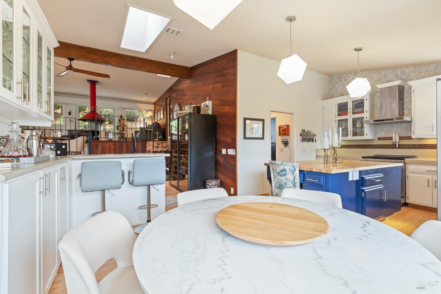 410 Oak Mesa Court Santa Rosa, CA 95409 - Photo 16 of 41 a large kitchen with a table and chairs