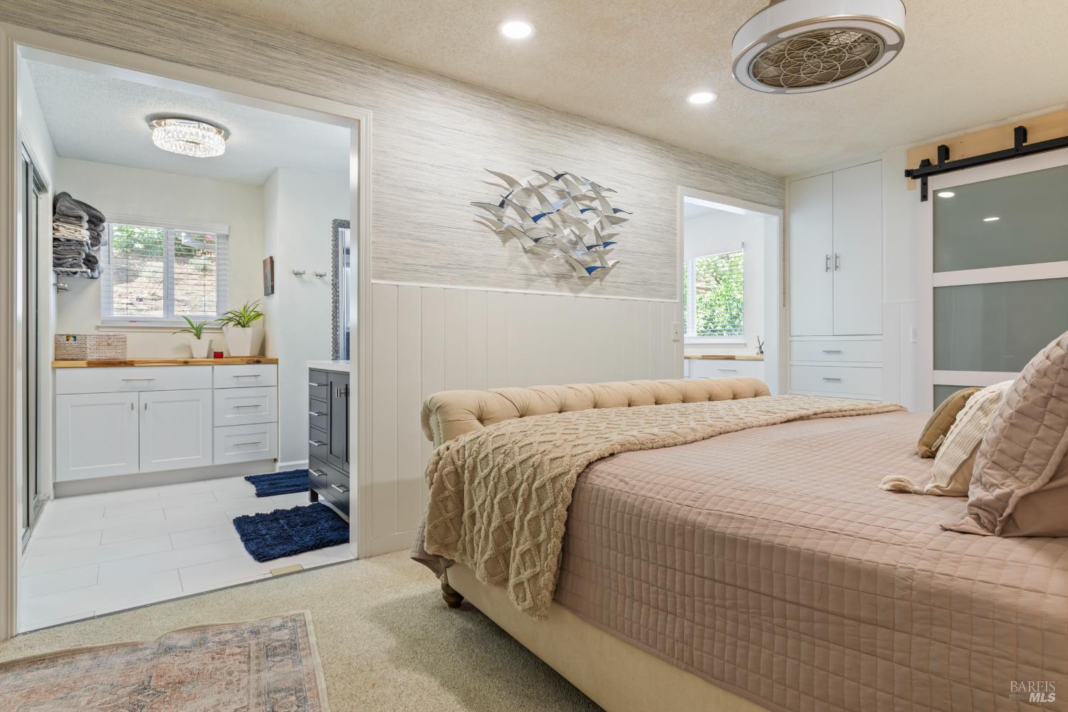 410 Oak Mesa Court Santa Rosa, CA 95409 - Photo 19 of 41 a bedroom with a bed a rug and a window