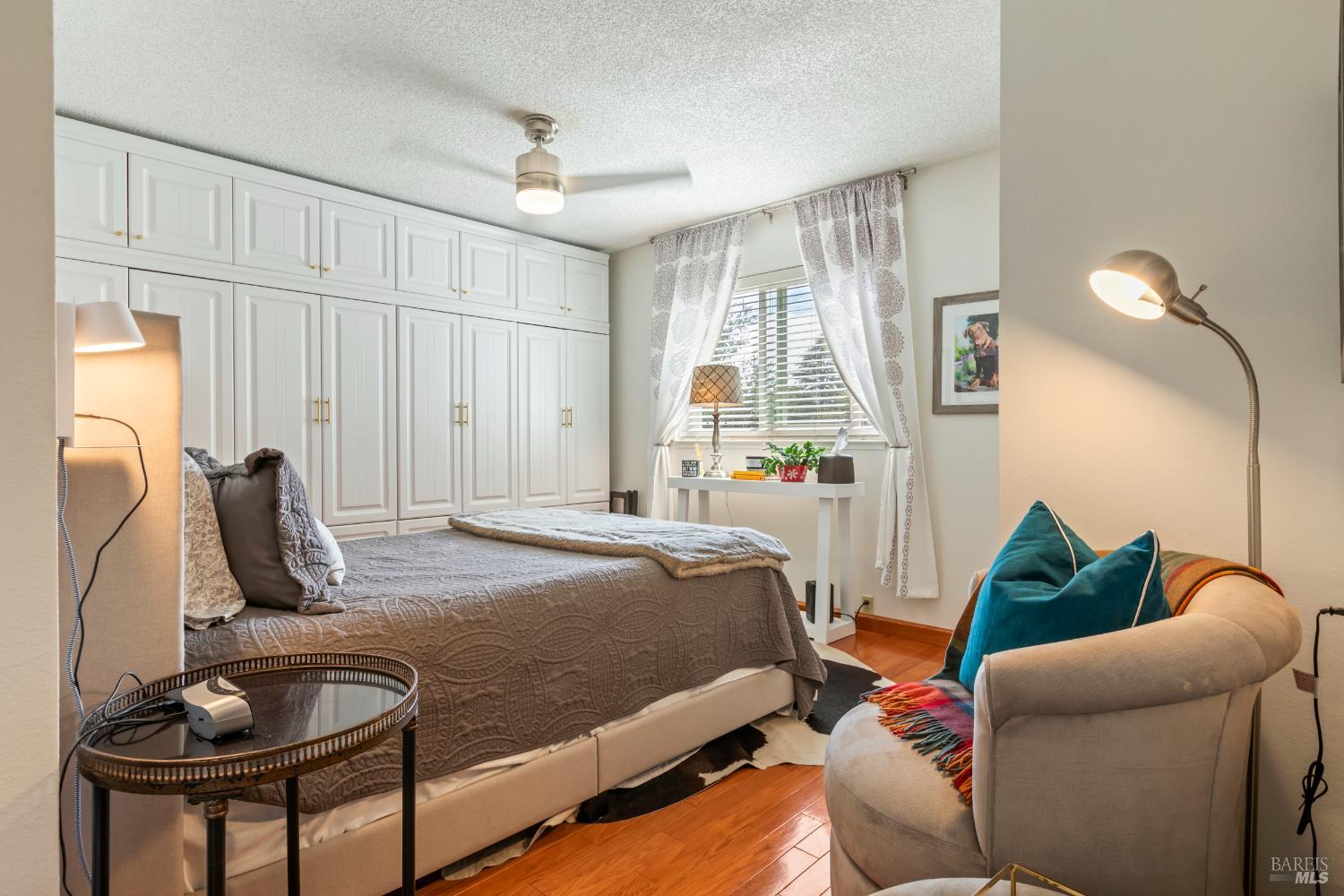 410 Oak Mesa Court Santa Rosa, CA 95409 - Photo 26 of 41 a bedroom with a bed and a window