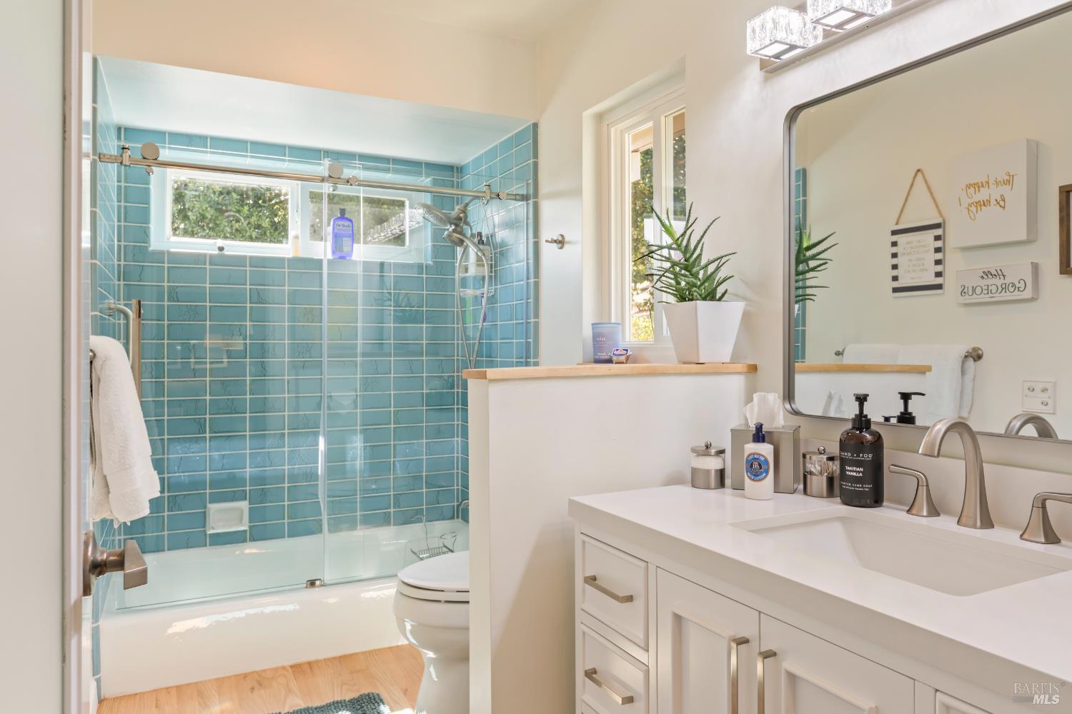 410 Oak Mesa Court Santa Rosa, CA 95409 - Photo 29 of 41 a bathroom with a sink and a mirror
