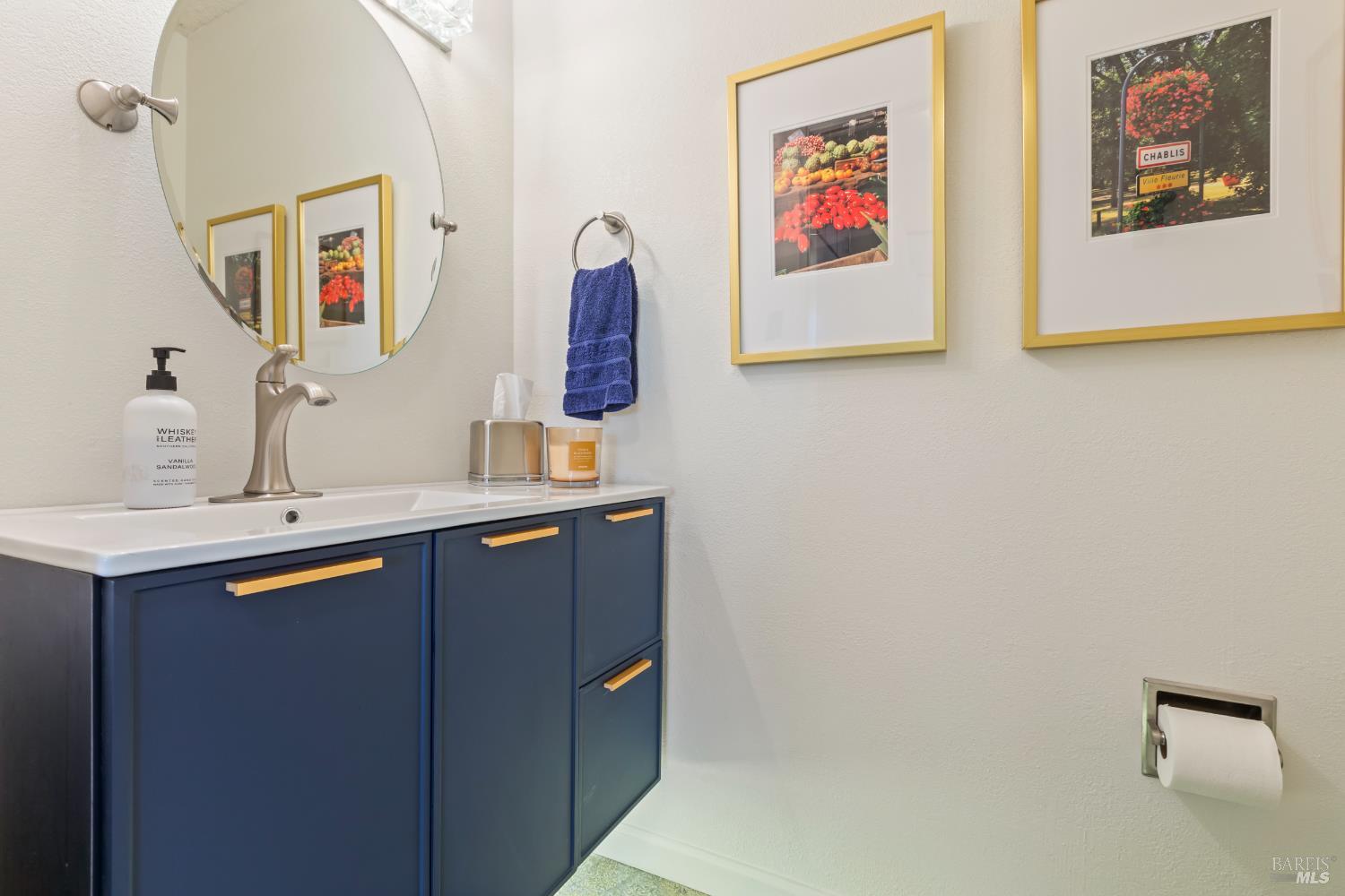 410 Oak Mesa Court Santa Rosa, CA 95409 - Photo 32 of 41 a bathroom with a sink and a mirror