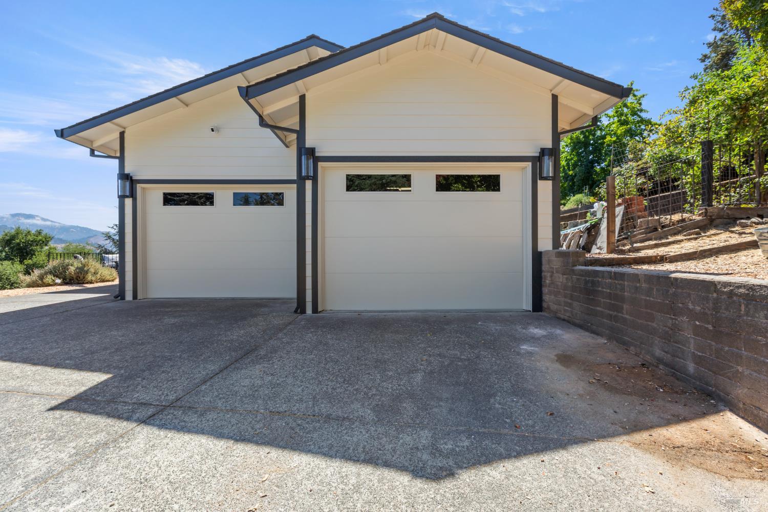 410 Oak Mesa Court Santa Rosa, CA 95409 - Photo 37 of 41 a view of a house with a yard and garage
