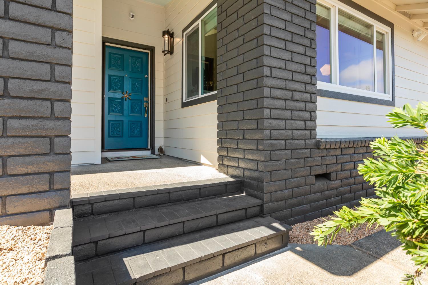 410 Oak Mesa Court Santa Rosa, CA 95409 - Photo 5 of 41 a front view of a house with a yard
