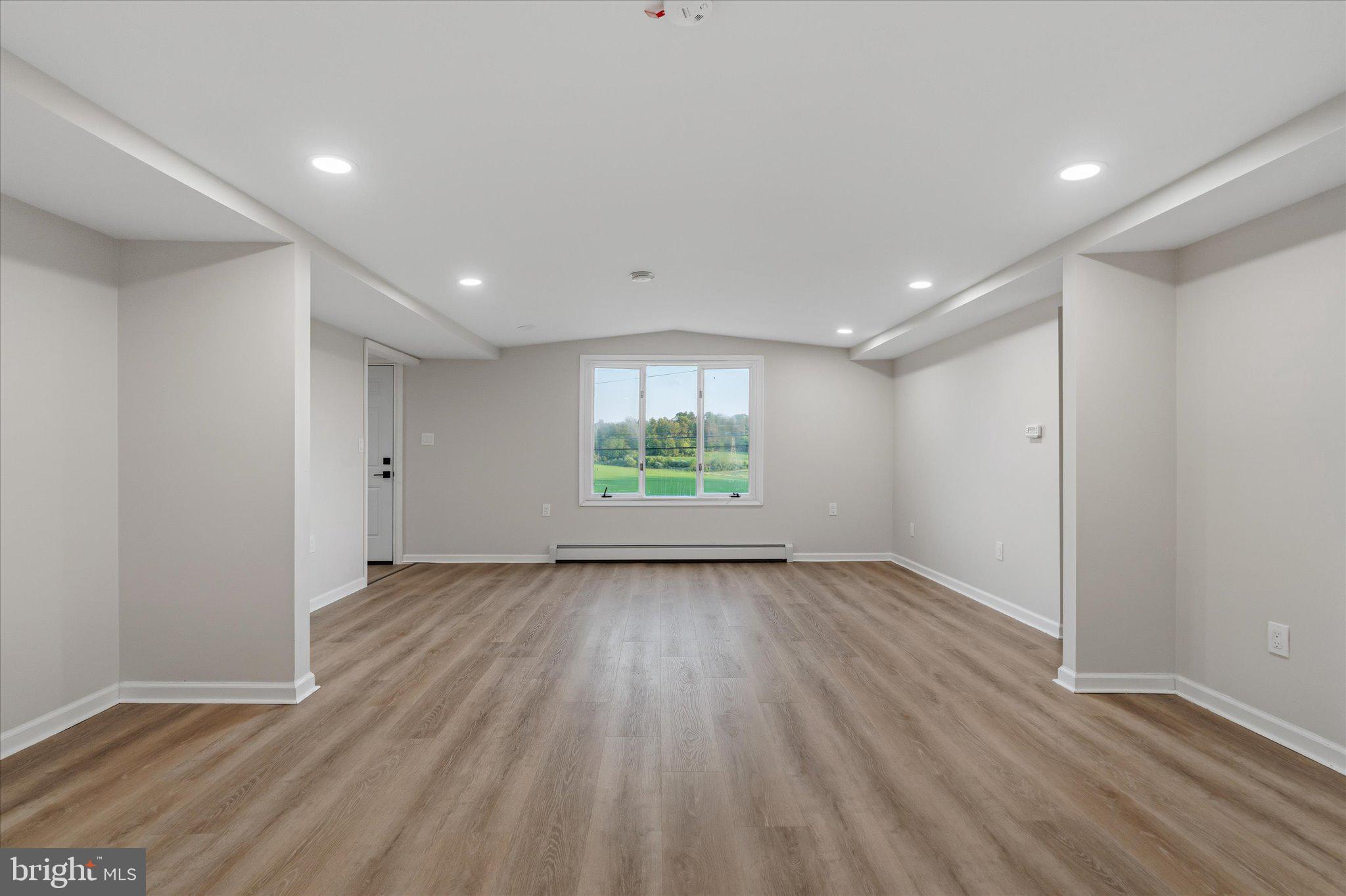 831 Deturksville Road Pine Grove, PA 17963 - Photo 24 of 24 wooden floor in an empty room with a window