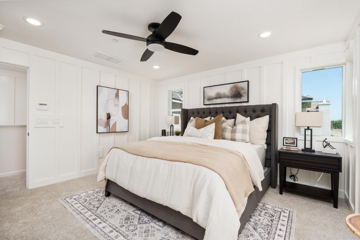 1465 Farmhouse Lane Clovis, CA 93619 - Photo 24 of 33 a bedroom with a bed and a chandelier