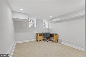 230 North Luzerne Avenue Baltimore, MD 21224 - Photo 16 of 18 Bright and versatile basement workspace.