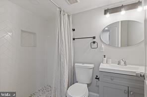 230 North Luzerne Avenue Baltimore, MD 21224 - Photo 17 of 18 Modern bathroom with sleek finishes.