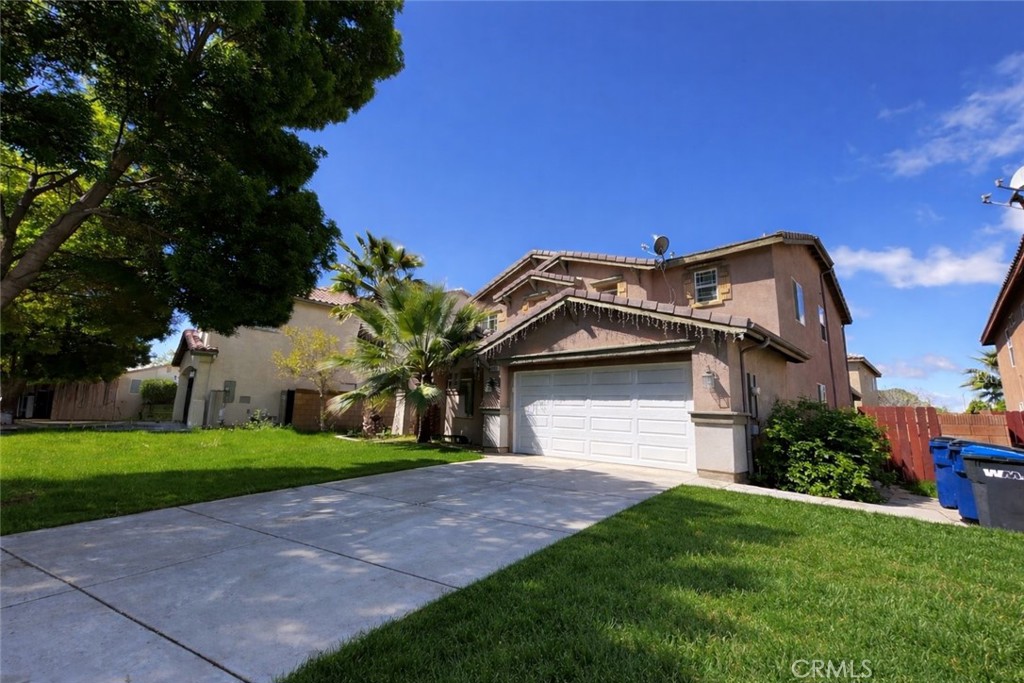 43009 23rd Street West Lancaster, CA 93536 - Photo 2 of 2 a front view of a house with a yard