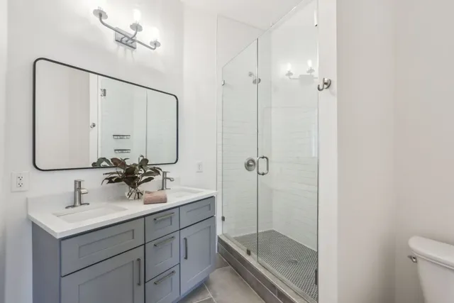 a bedroom with a bed and a lamp