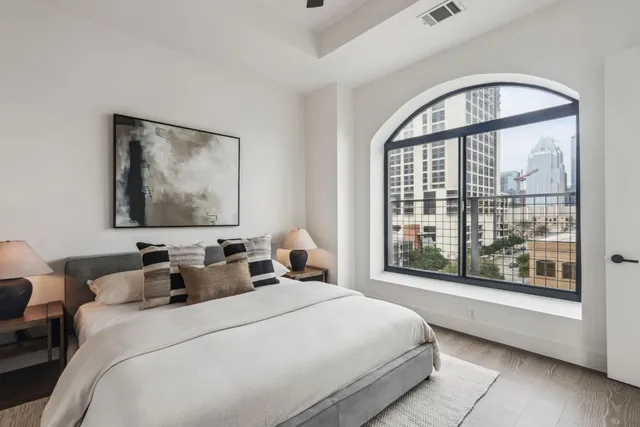 a kitchen with a sink a counter top space cabinets and stainless steel appliances