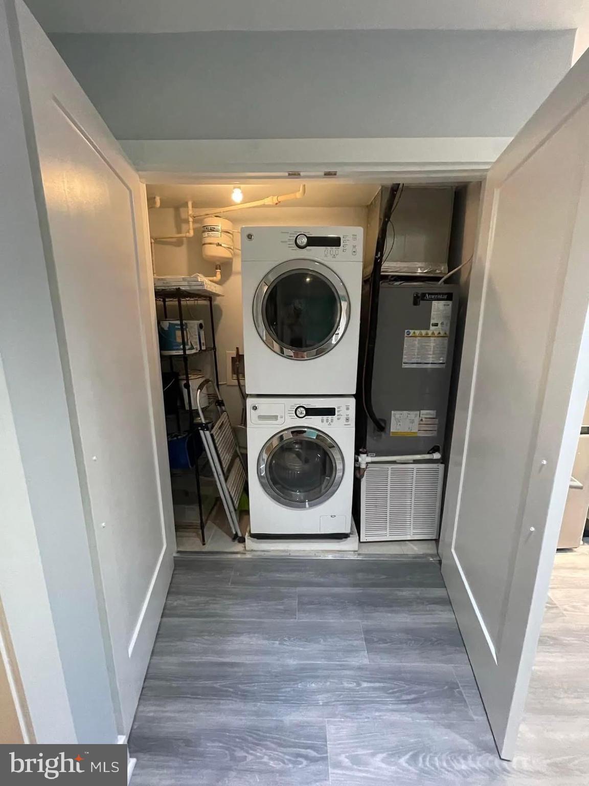 1209 G Street Southeast, Unit 2 Washington, DC 20003 - Photo 13 of 15 a utility room with wooden floor washer and dryer