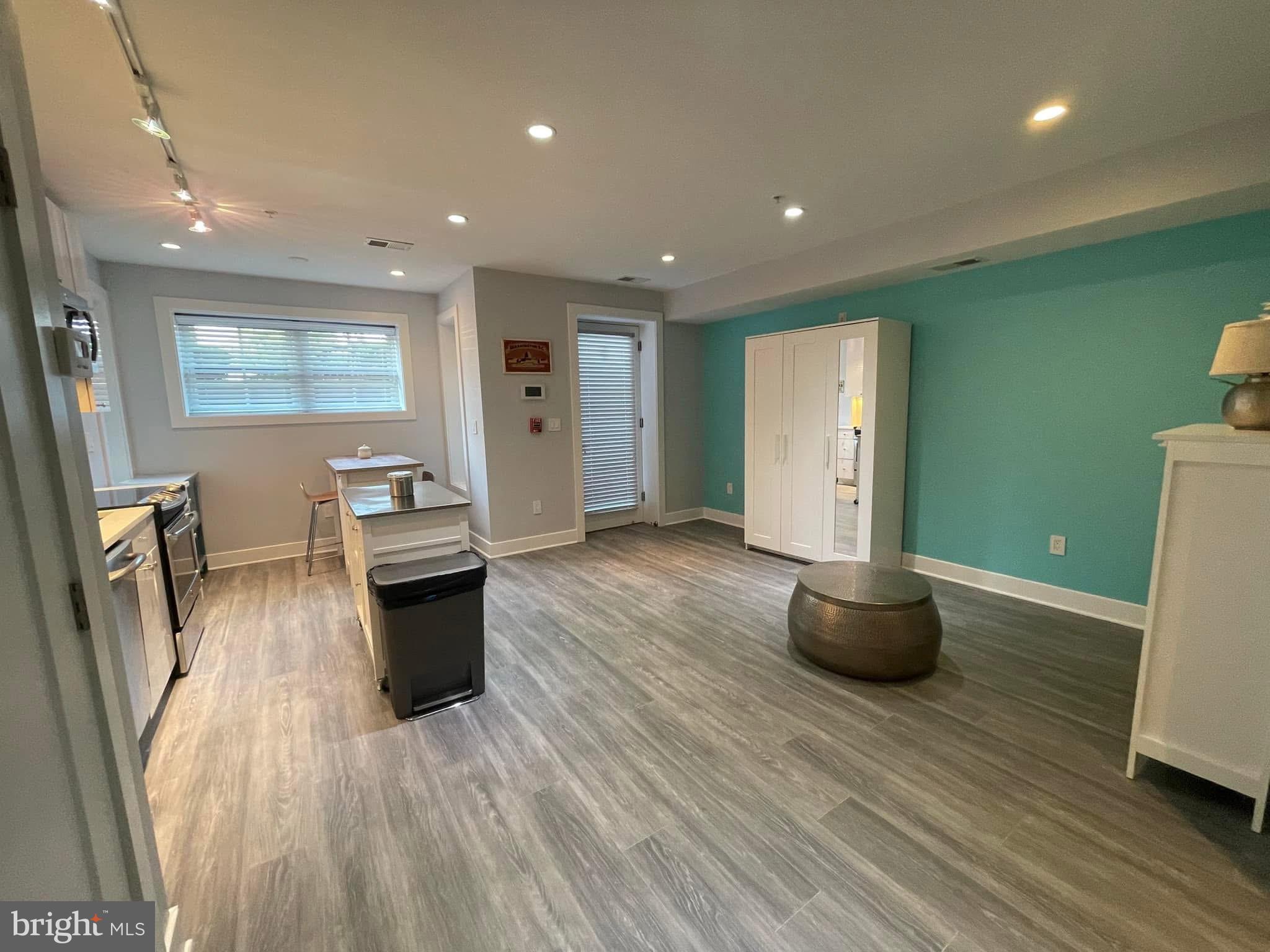 1209 G Street Southeast, Unit 2 Washington, DC 20003 - Photo 2 of 15 a living room with furniture and a wooden floor