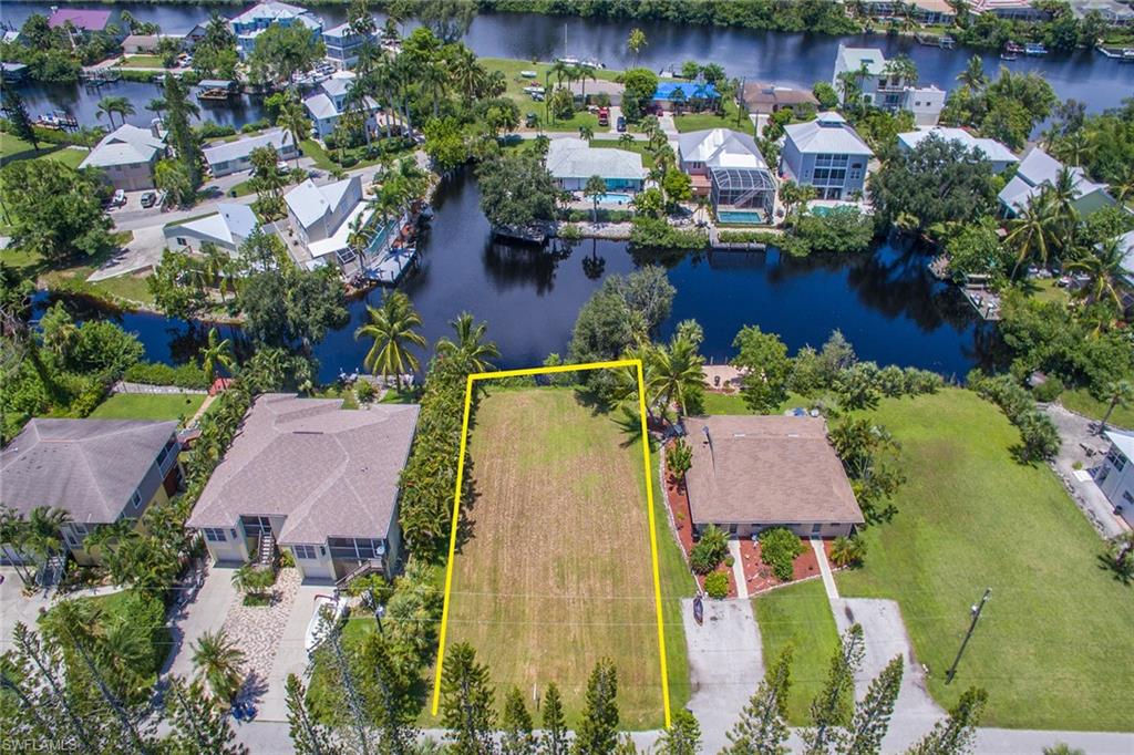3665 Riviera Circle Bonita Springs, FL 34134 - Photo 11 of 24 an aerial view of house with yard swimming pool and outdoor seating