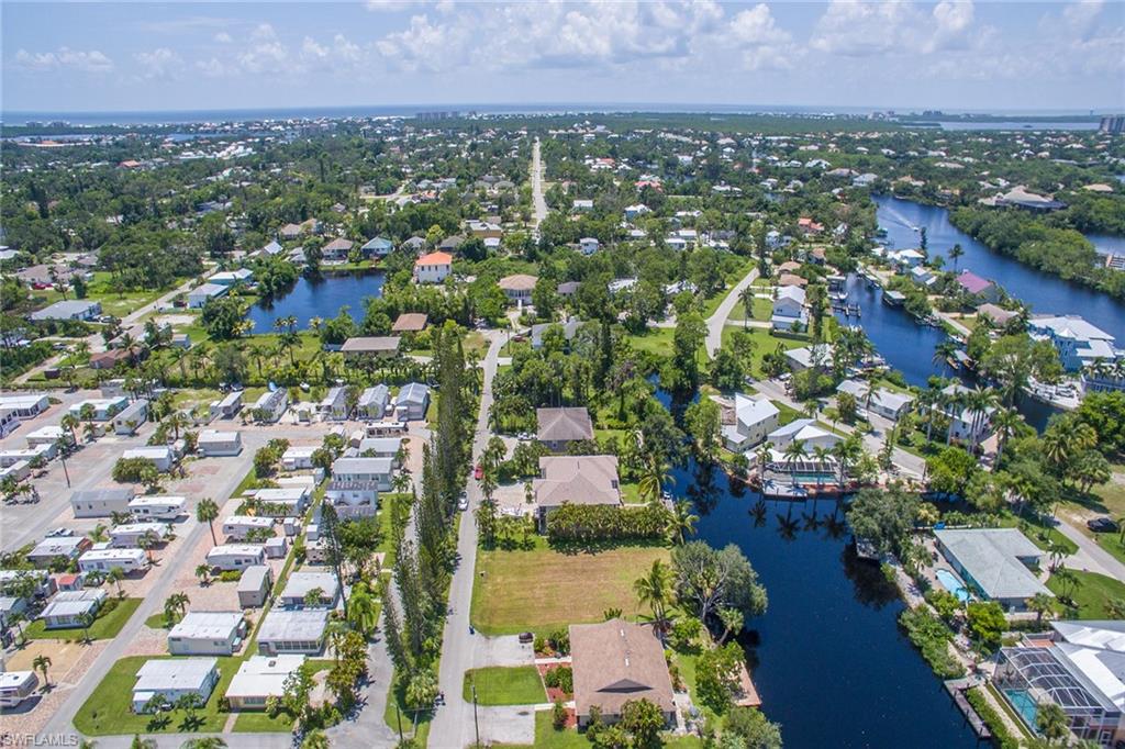 3665 Riviera Circle Bonita Springs, FL 34134 - Photo 20 of 24 an aerial view of residential houses with city view