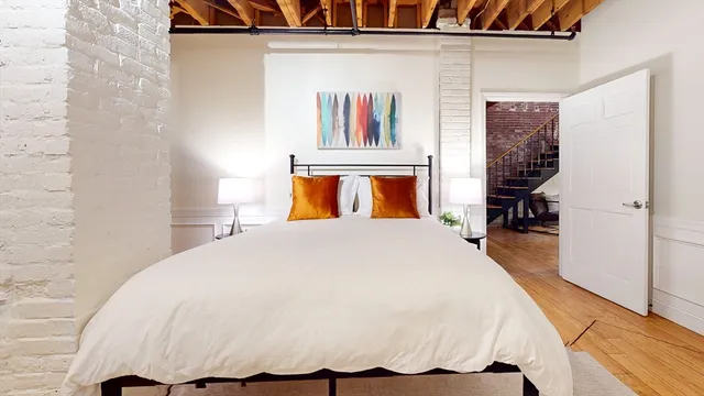 a bedroom with a bed and a walk in closet