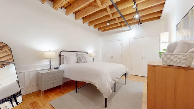 a bedroom with a bed and window