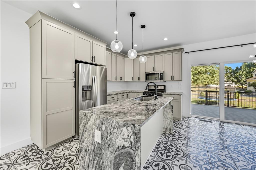 5237 Virginia Road Hermitage, PA 16148 - Photo 11 of 49 a kitchen with granite countertop a refrigerator and a sink