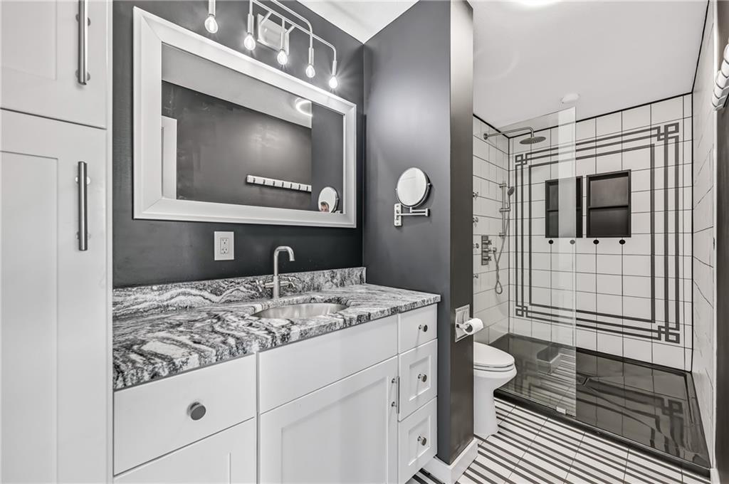 5237 Virginia Road Hermitage, PA 16148 - Photo 20 of 49 a bathroom with a sink a toilet and mirror