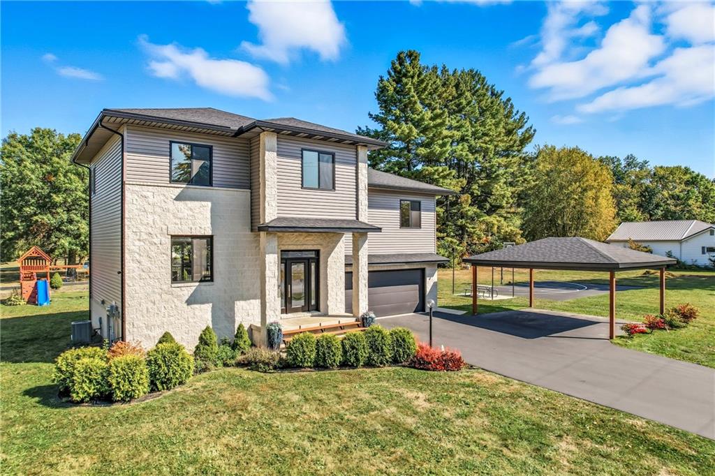 5237 Virginia Road Hermitage, PA 16148 - Photo 2 of 49 a front view of a house with garden