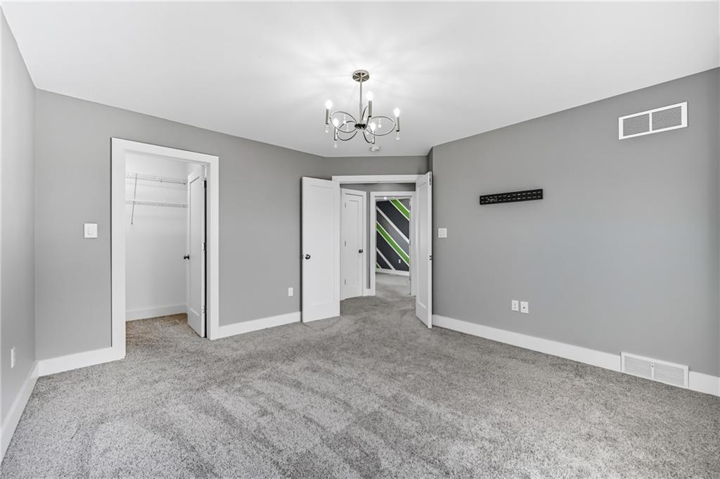 5237 Virginia Road Hermitage, PA 16148 - Photo 24 of 49 a view of a chandelier in big room and a bathroom