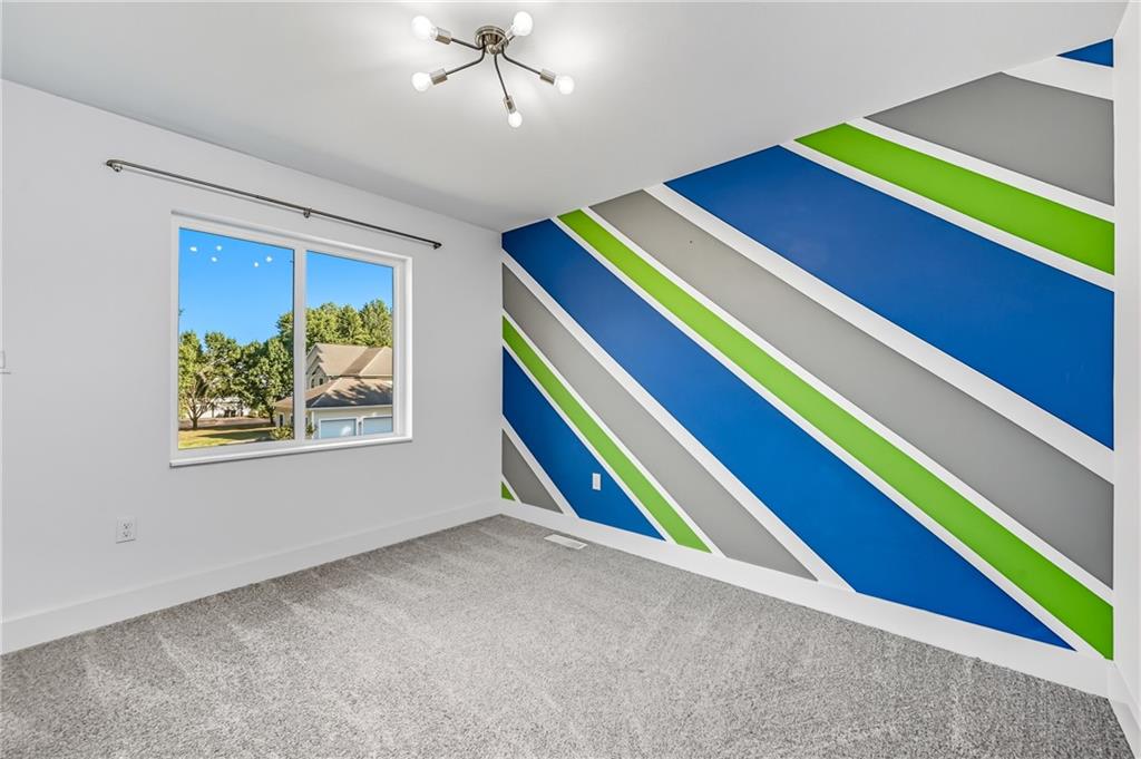 5237 Virginia Road Hermitage, PA 16148 - Photo 26 of 49 a room that has a bed and a chandelier