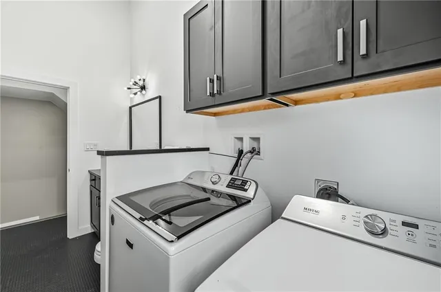 a stove top oven sitting inside of a kitchen