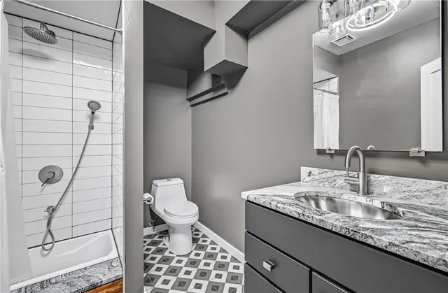 a view of a deck with wooden floor and fence next to a yard