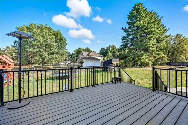 a view of a balcony with wooden floor
