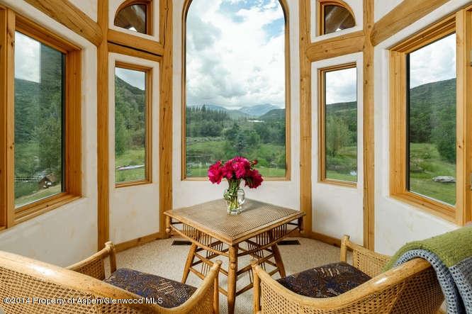 3768 Snowmass Creek Road Snowmass, CO 81654 - Photo 14 of 28 a living room with furniture and window