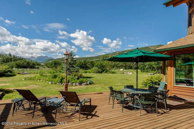 3768 Snowmass Creek Road Snowmass, CO 81654 - Photo 15 of 28 an outdoor space with furniture and garden view