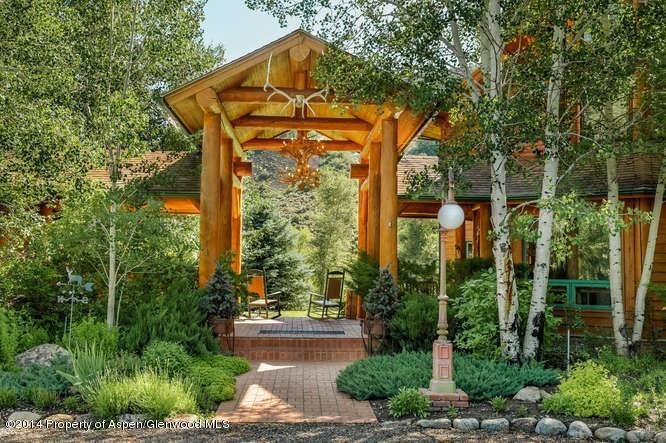 3768 Snowmass Creek Road Snowmass, CO 81654 - Photo 19 of 28 a front view of a house with garden