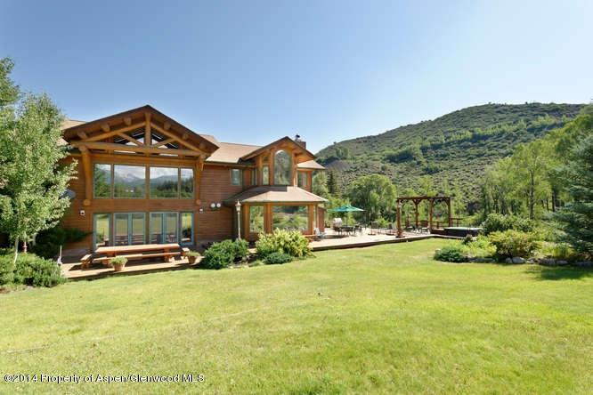 3768 Snowmass Creek Road Snowmass, CO 81654 - Photo 9 of 28 a front view of a house with a yard