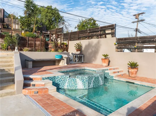swimming pool view with a outdoor seating