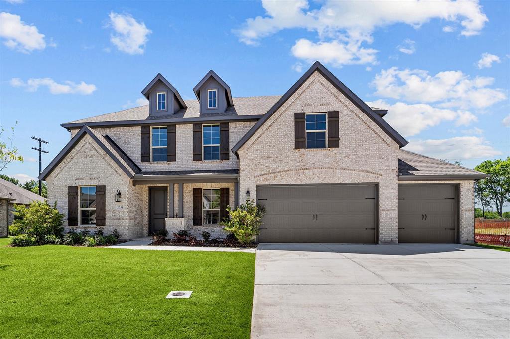 1337 Benjamin Trail Van Alstyne, TX 75495 - Photo 1 of 27 a front view of a house with a yard and garage
