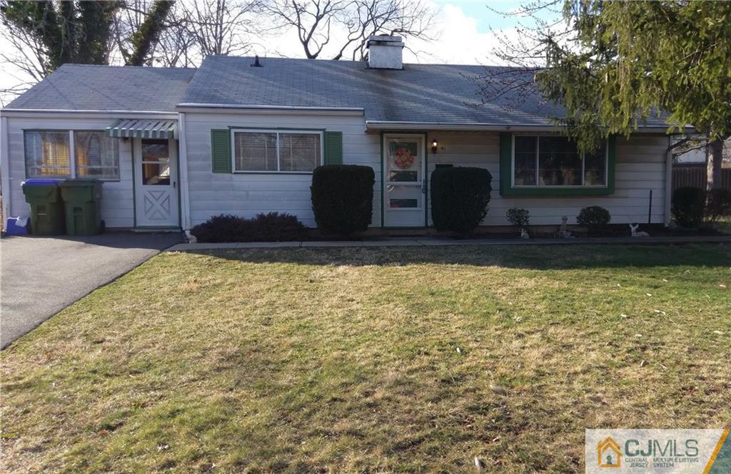 41 Winthrop Road Edison, NJ 08817 - Photo 1 of 18 a view of a house with a large window and a yard