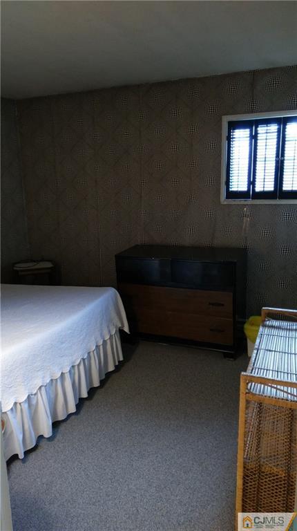 41 Winthrop Road Edison, NJ 08817 - Photo 13 of 18 a spacious bedroom with a bed and a window