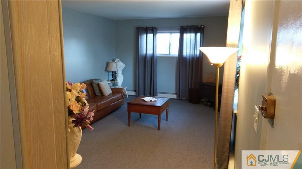 41 Winthrop Road Edison, NJ 08817 - Photo 8 of 18 a living room with furniture and a window