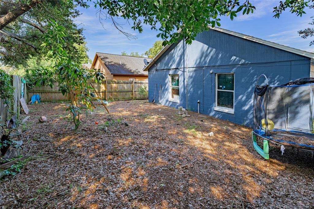 5624 Indialantic Drive Orlando, FL 32808 - Photo 17 of 17 a view of a house with a yard