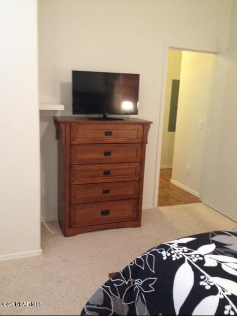 1250 South Rialto, Unit 62 Mesa, AZ 85209 - Photo 15 of 24 a living room with furniture and a flat screen tv