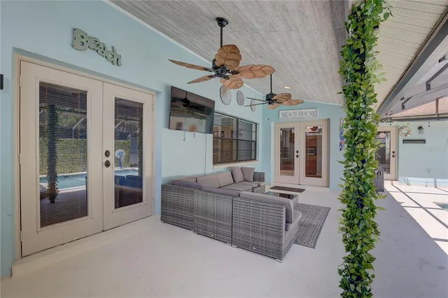 a view of a backyard with pool table and chairs