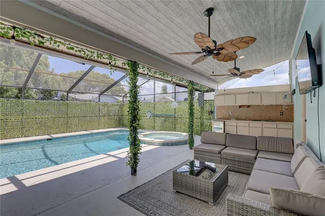 a view of a backyard with sitting area