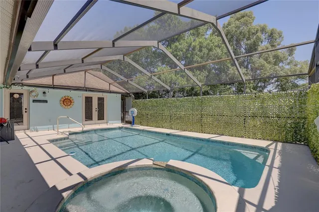 a view of a swimming pool with a patio