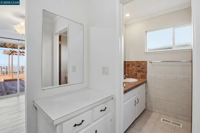 a bathroom with a sink a mirror and shower