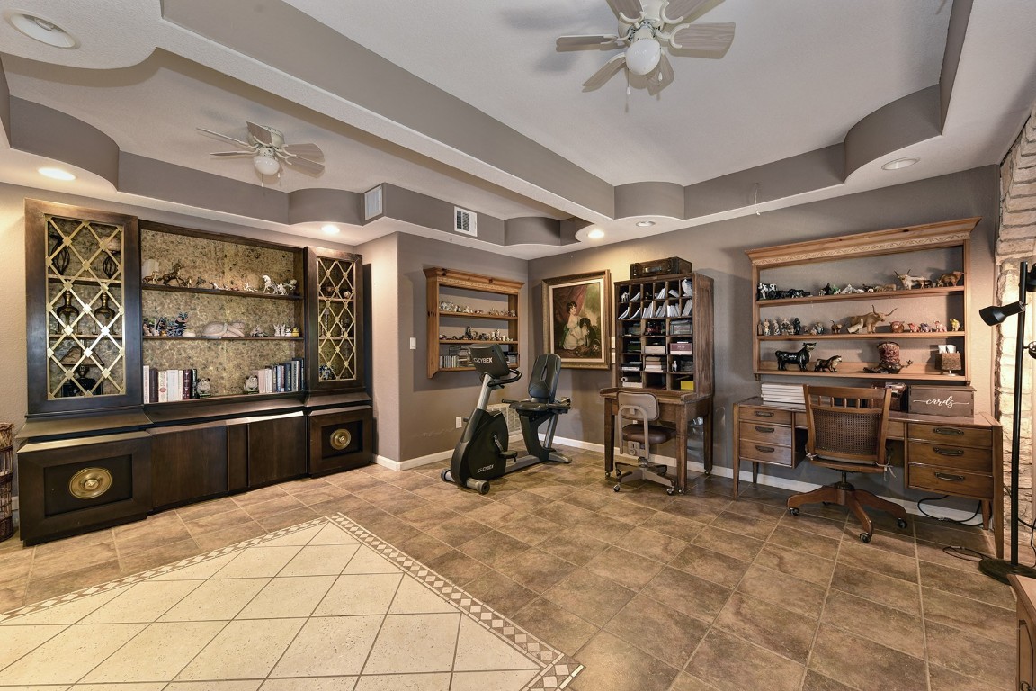 4525 Bell Springs Road Dripping Springs, TX 78620 - Photo 14 of 38 a view of a room with gym equipment
