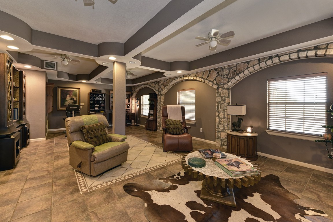 4525 Bell Springs Road Dripping Springs, TX 78620 - Photo 16 of 38 a living room with furniture and a large window